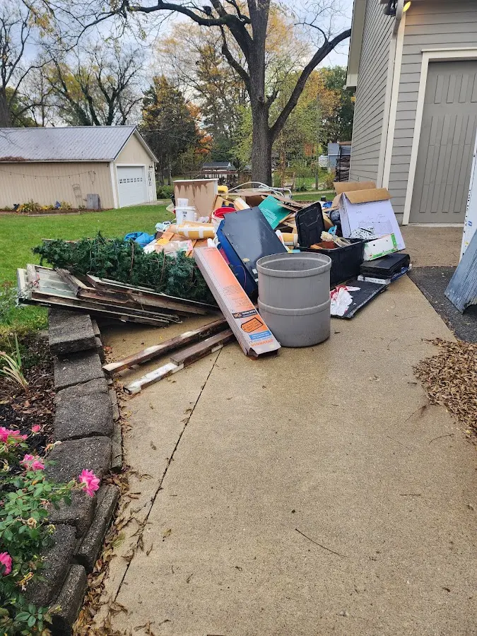 Dumpster being loaded with debris for 3 Yard Dumpster Rental in Minneapolis